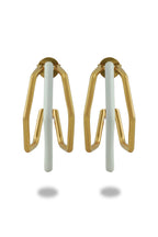 Small trio white enamel hoops by Varnika Arora featuring three delicate white enamel hoop earrings on a plain background.
