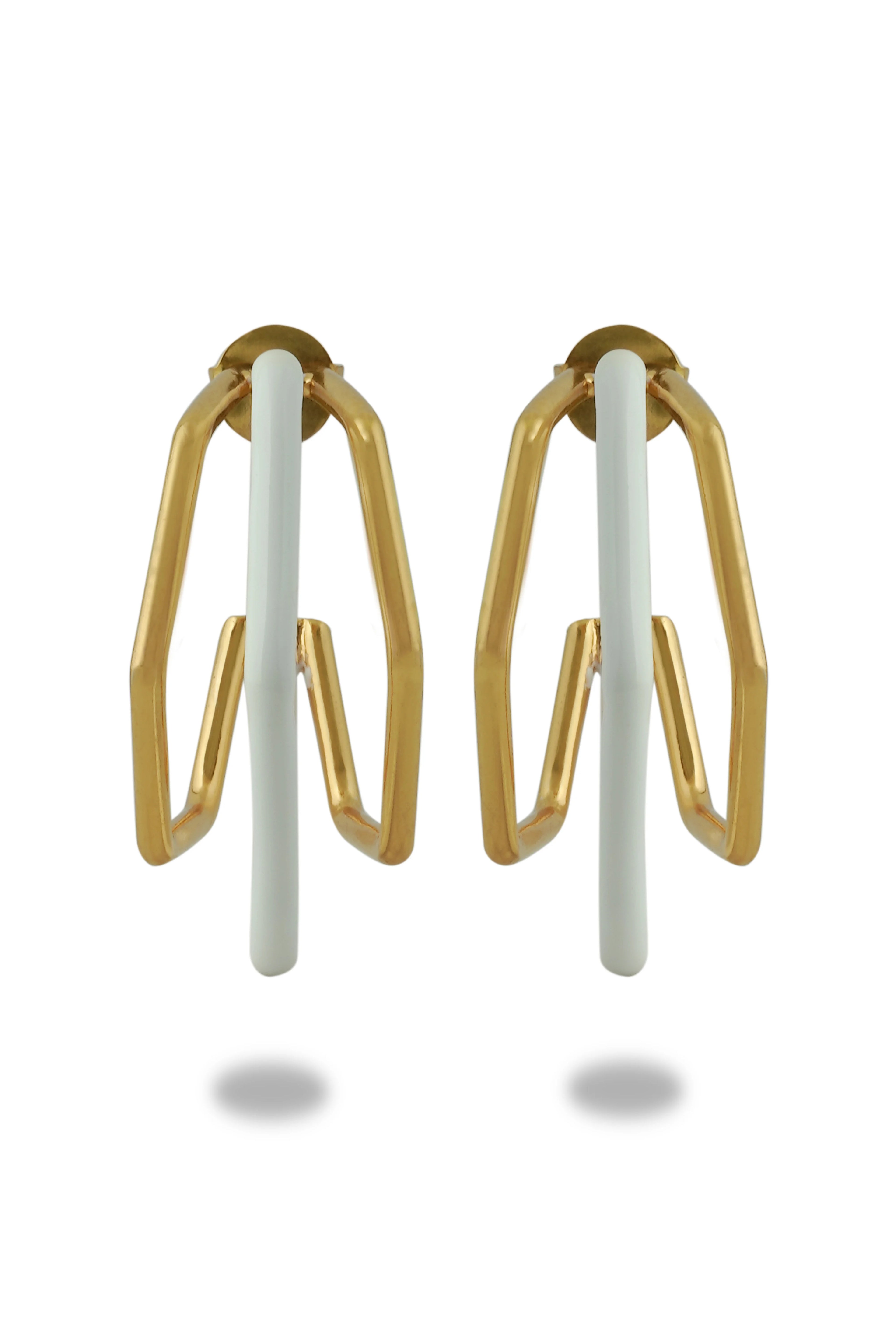 Small trio white enamel hoops by Varnika Arora featuring three delicate white enamel hoop earrings on a plain background.