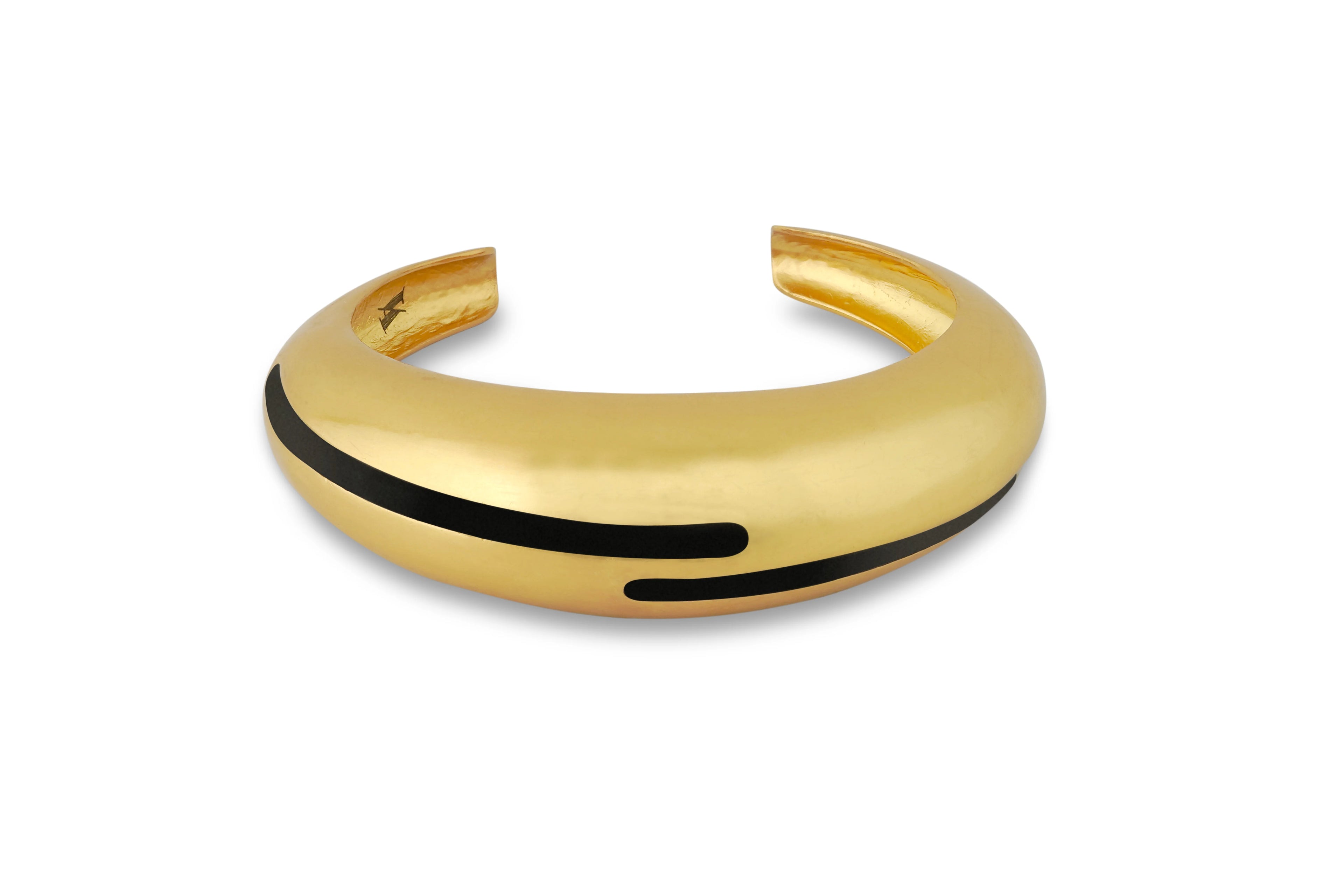 Varnika Arora black enamel gold bangle with a sleek, circular design, showcasing elegant craftsmanship and modern jewelry style.