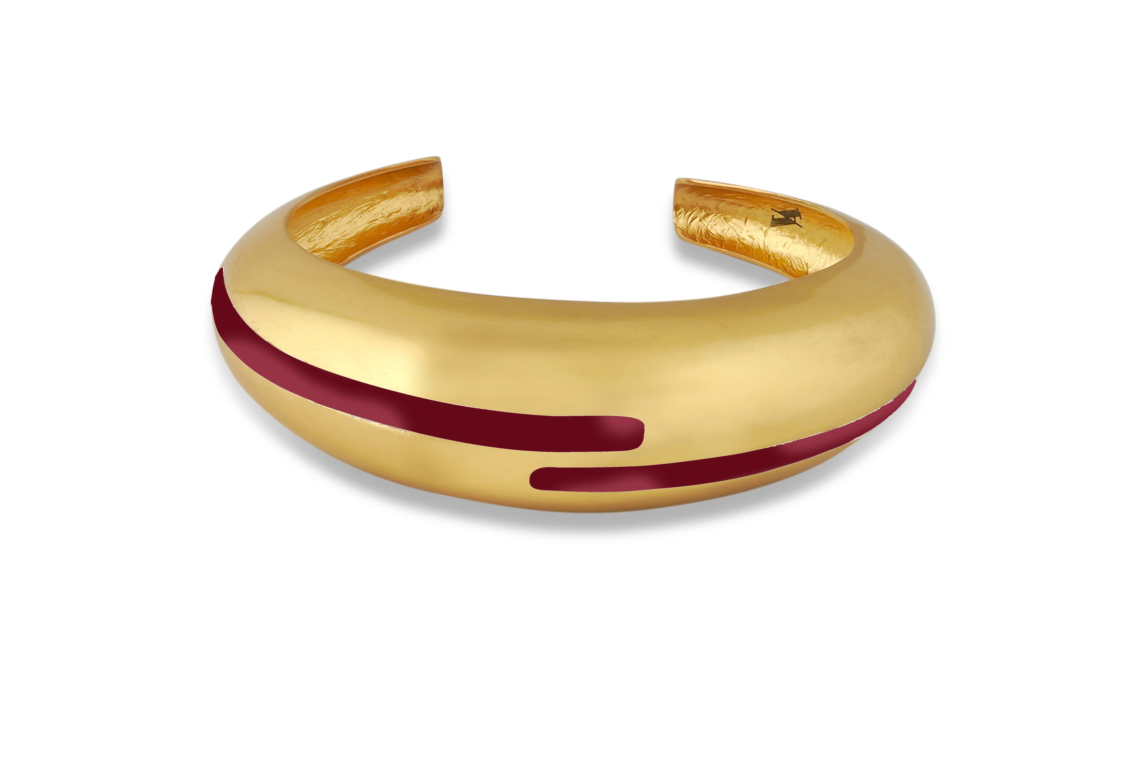 Varnika Arora maroon enamel gold bangle with intricate design, showcasing a stylish circlet jewelry piece on a white background.