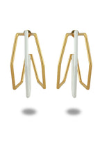Varnika Arora XL Trio white enamel gold hoop earrings, large hoops with white enamel accents and gold finish, close-up view