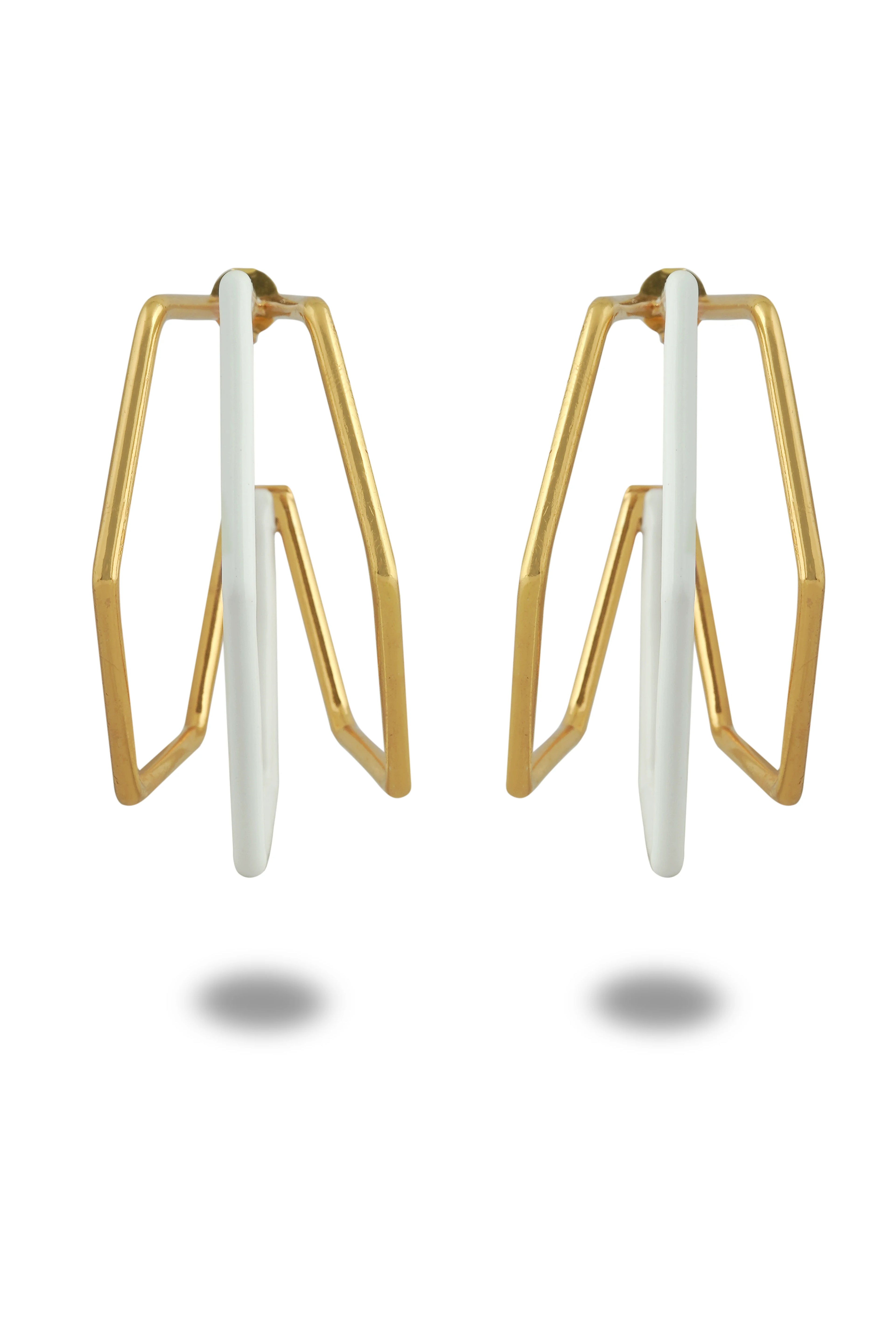 Varnika Arora XL Trio white enamel gold hoop earrings, large hoops with white enamel accents and gold finish, close-up view