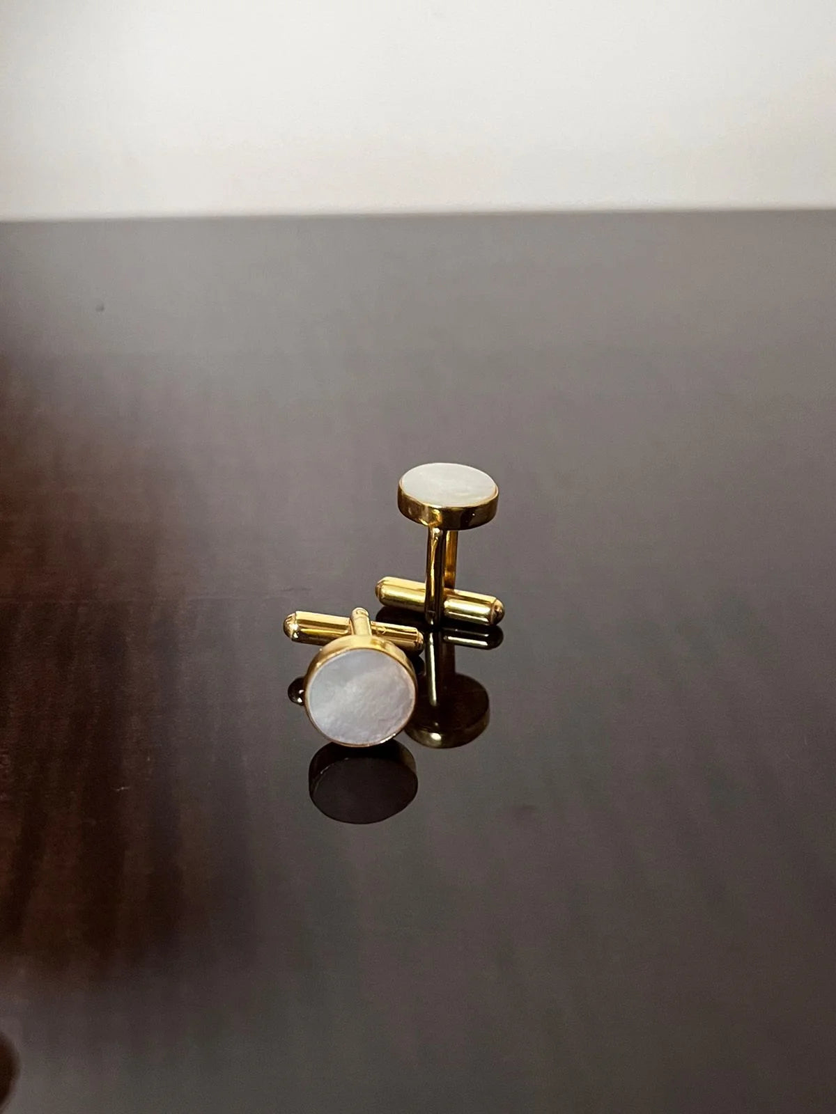 VARNIKA ARORA MOP cufflinks in jewelry, featuring polished mother of pearl design and silver-tone finish.