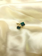 VARNIKA ARORA malachite cufflinks in a jewelry image showcasing polished green gemstone accents and silver-tone metal design.