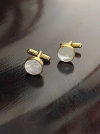 VARNIKA ARORA MOP cufflinks in elegant jewelry style, featuring a polished, multicolored mother-of-pearl design on a sleek metal setting.