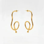 Varnika Arora Big Drift Hoop earrings featuring large gold hoops with intricate design, stylish jewelry accessory