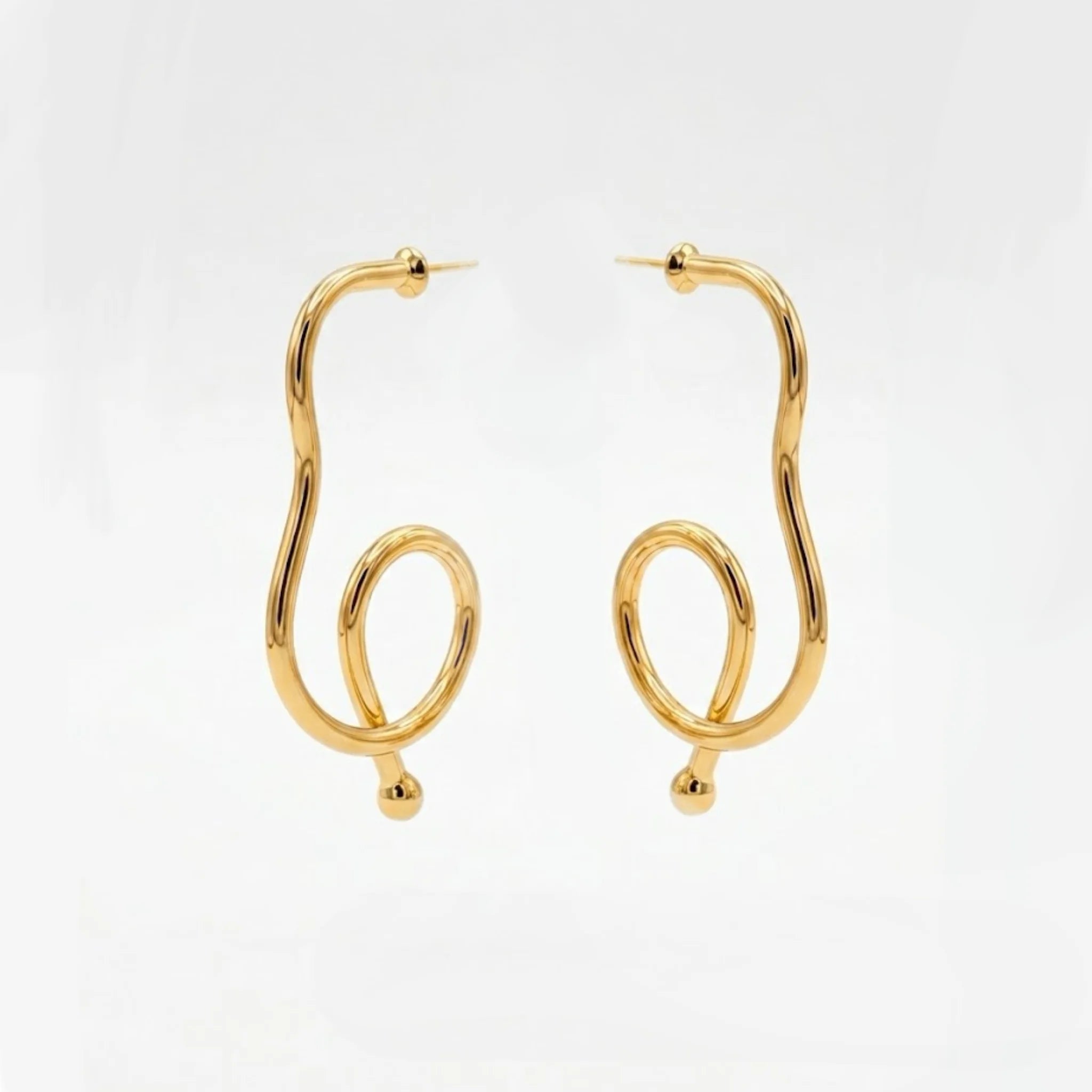 Varnika Arora Big Drift Hoop earrings featuring large gold hoops with intricate design, stylish jewelry accessory