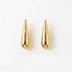 Varnika Arora Still Motion Drop jewelry piece featuring elegant, flowing design with shiny metallic finish.