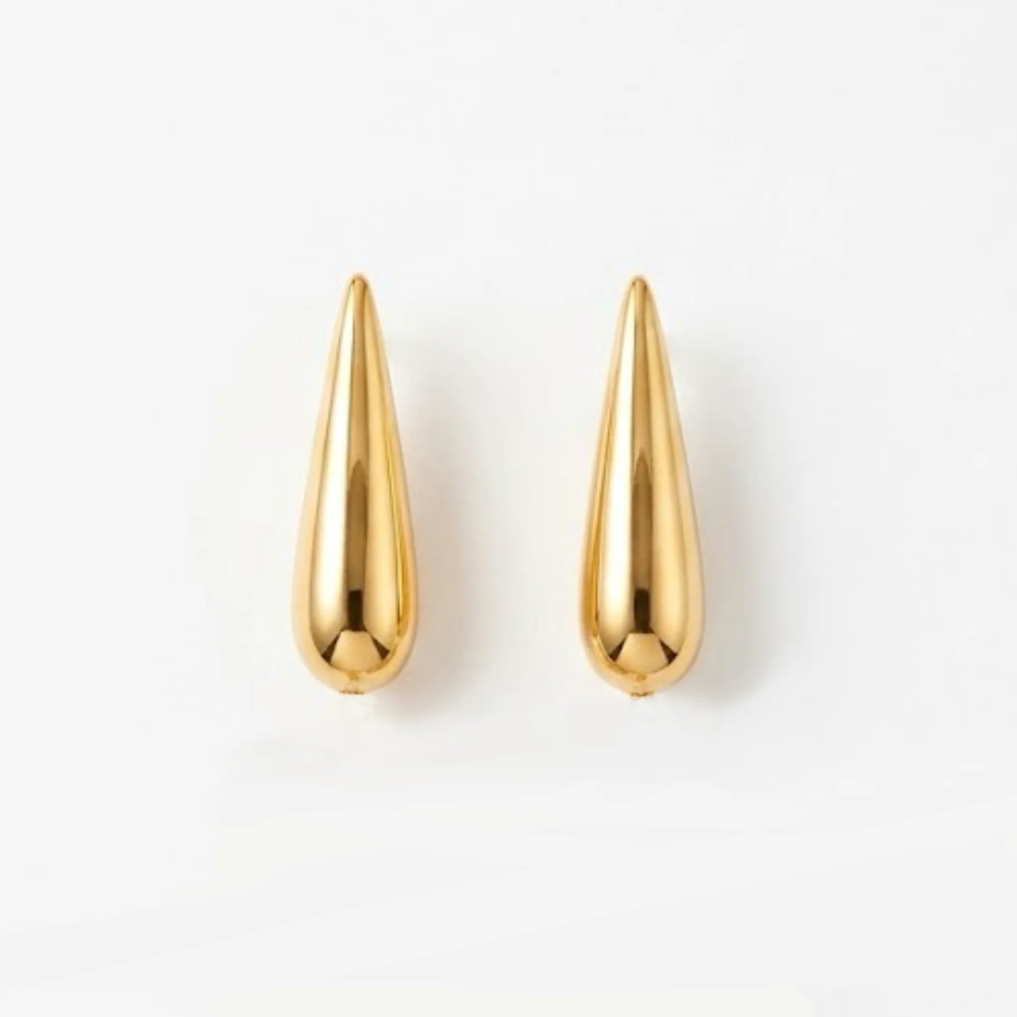 Varnika Arora Still Motion Drop jewelry piece featuring elegant, flowing design with shiny metallic finish.