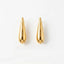 Varnika Arora Still Motion Drop jewelry piece featuring elegant, flowing design with shiny metallic finish.