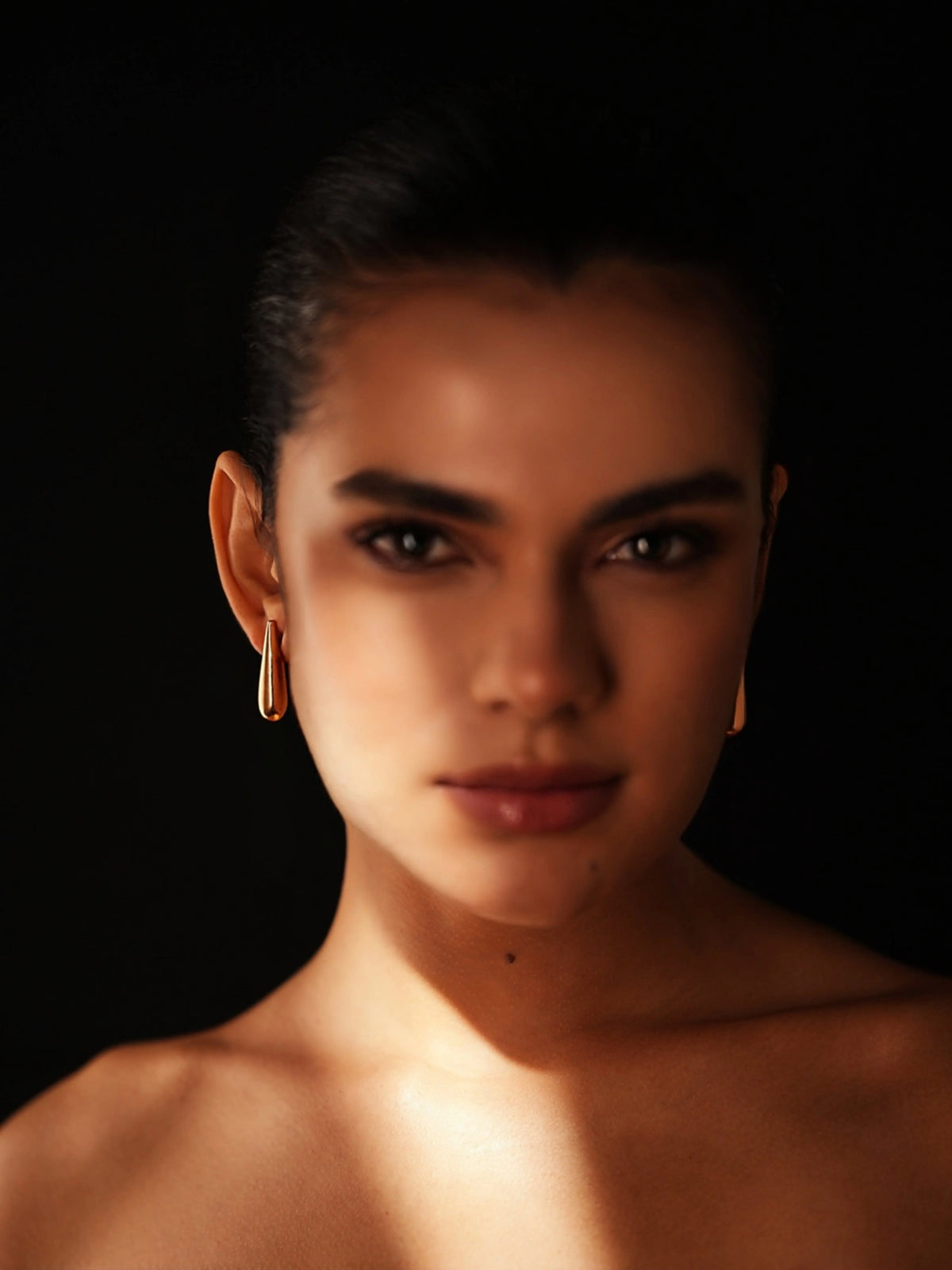 Varnika Arora Still Motion Drop jewelry piece featuring a sleek, modern design with a smooth, polished finish.