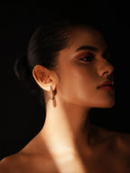Varnika Arora Still Motion Drop jewelry piece showcasing a sleek, modern design with flowing curves in silver finish.