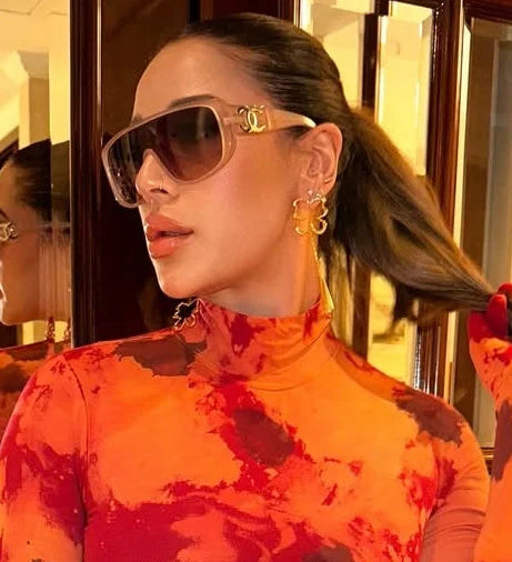 Krishna Shroff wearing Liquid Morpho Drop by Varnika Arora, showcasing vibrant, flowing liquid fabric in a stylish clothing design. Main image