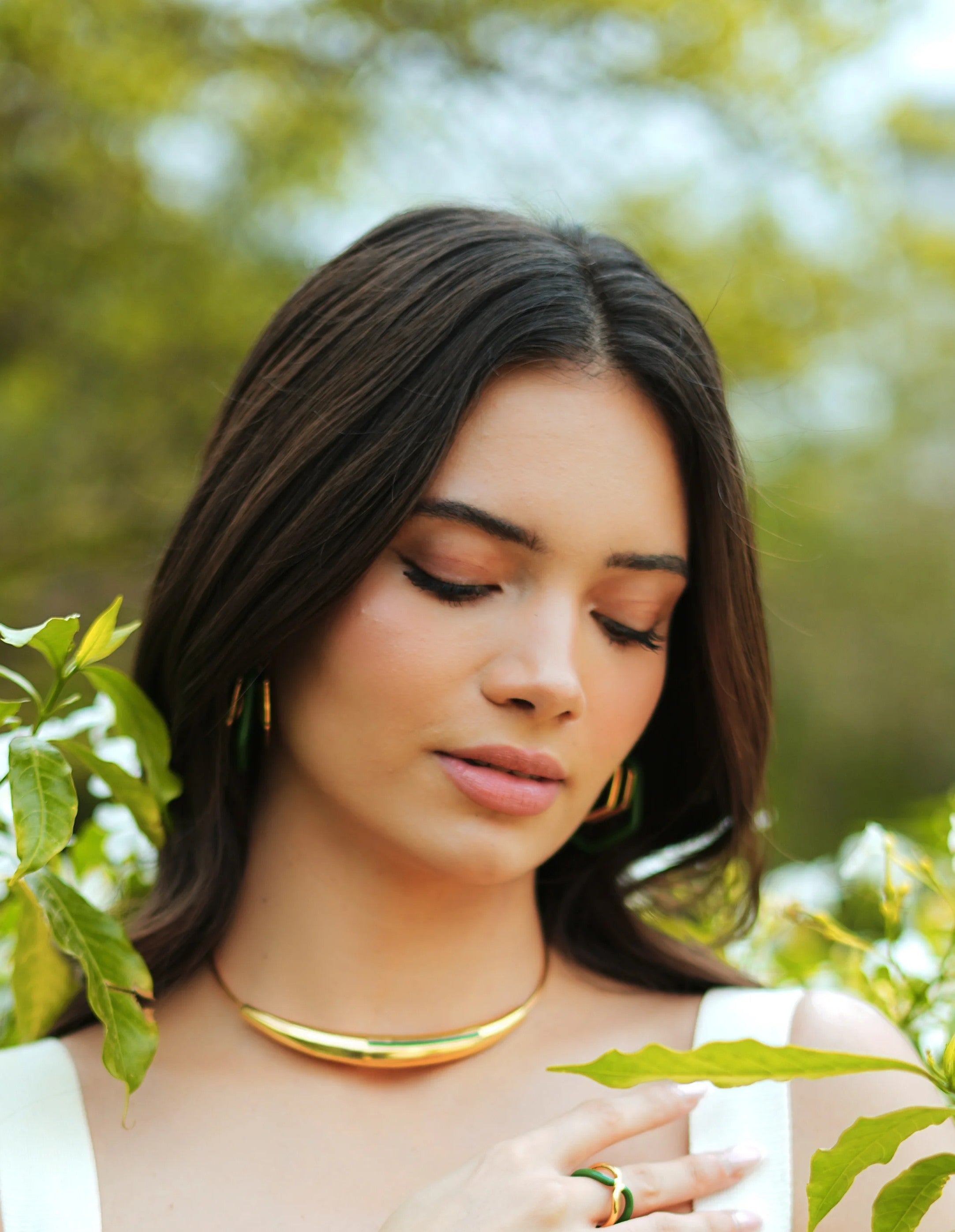 Varnika Arora Aurelia Green Enamel Gold Neckpiece showing intricate gold design with vibrant green enamel accents.