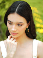 Small trio green enamel gold hoops by Varnika Arora featuring three layered hoop earrings with green enamel accents and gold finish.