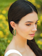 Small green enamel gold hoops by Varnika Arora, showcasing delicate hoop earrings with vibrant green enamel and gold finish.