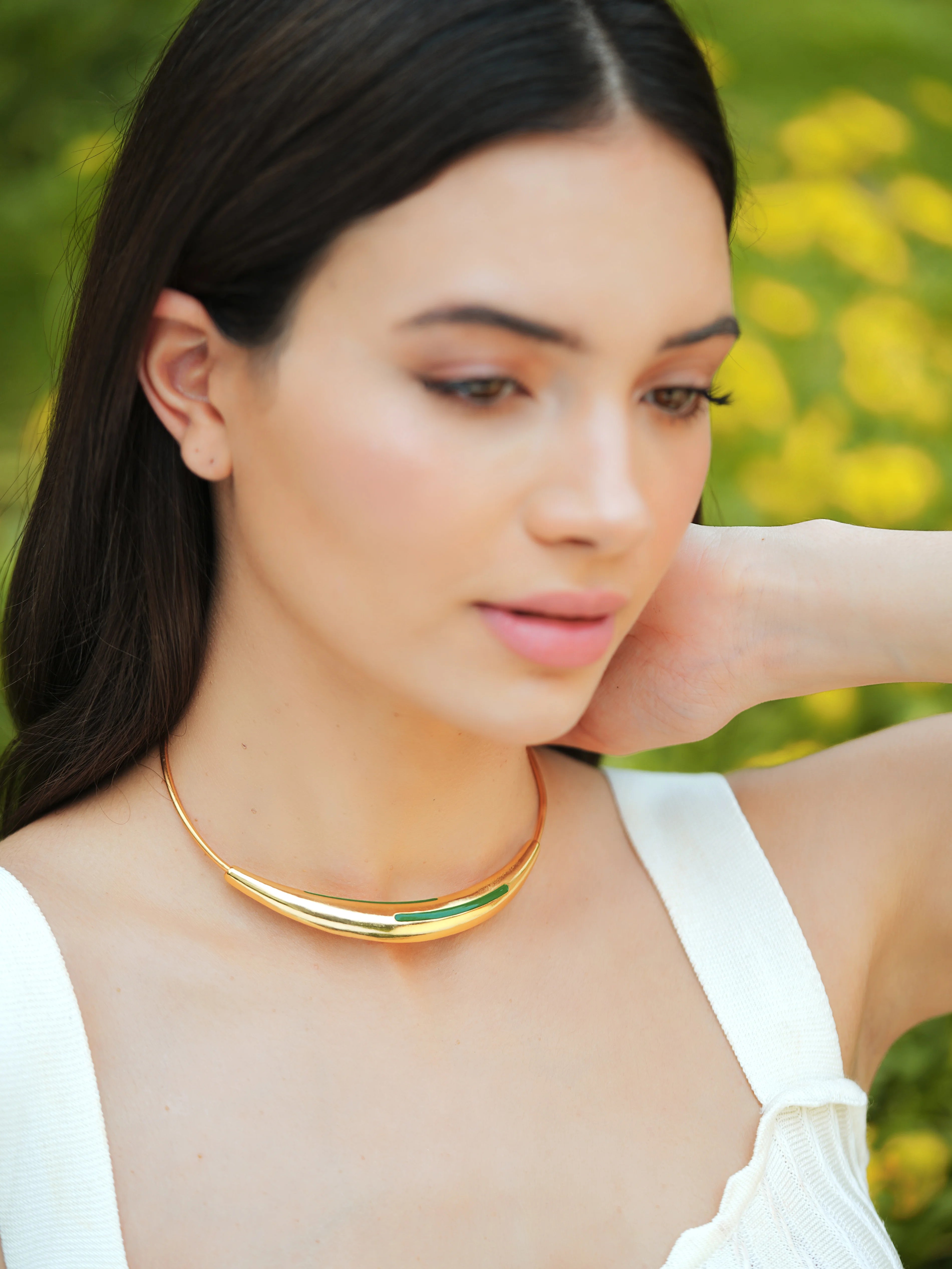 Varnika Arora Aurelia Green Enamel Gold Neckpiece with intricate design and elegant clasp, displayed on a neutral background.