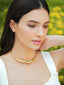 Varnika Arora Aurelia Green Enamel Gold Neckpiece with intricate design and elegant clasp, displayed on a neutral background.