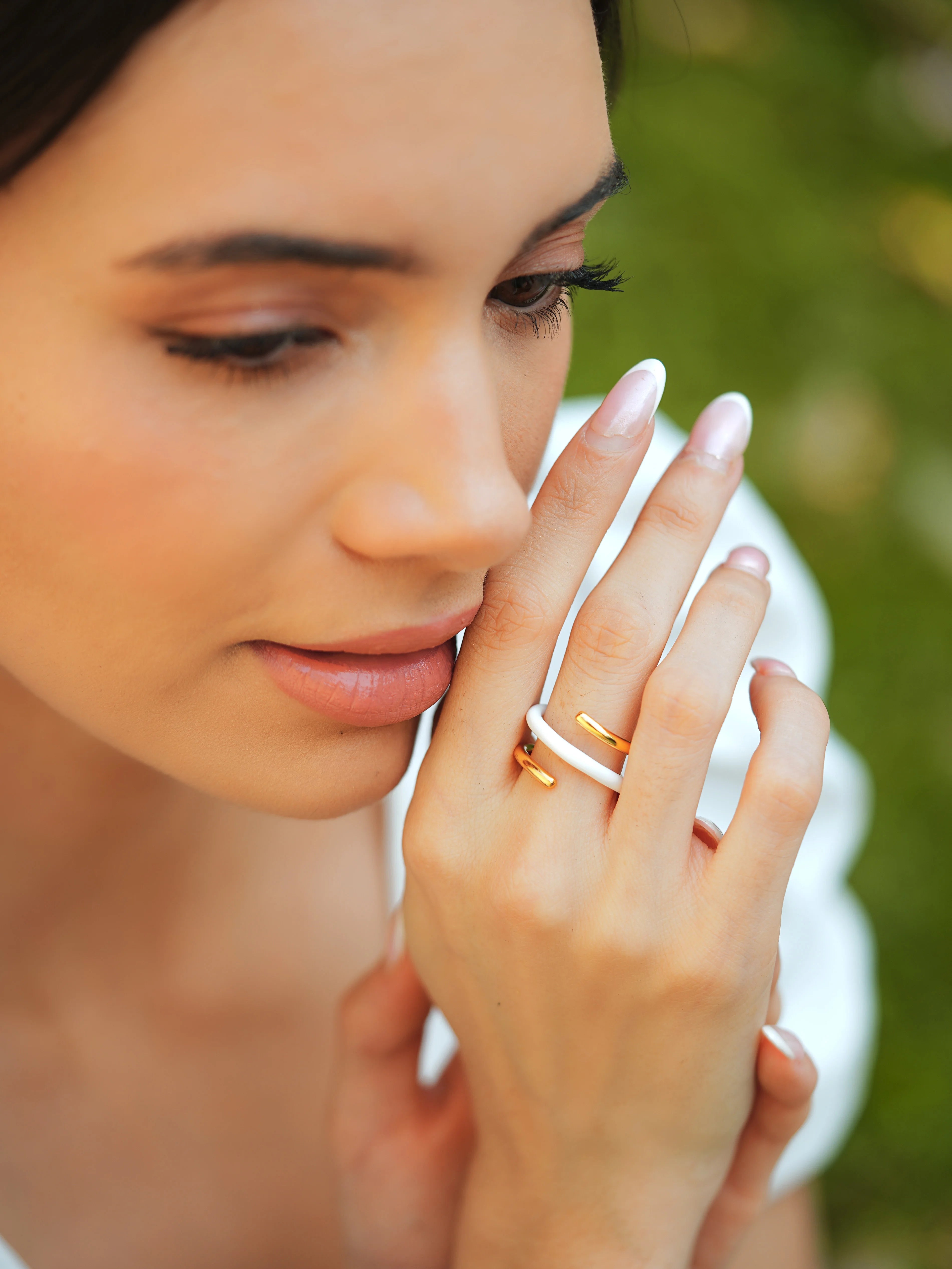 Varnika Arora Twistie 2-way white enamel gold ring showcasing a stylish, versatile design with glossy white enamel and gold finish.