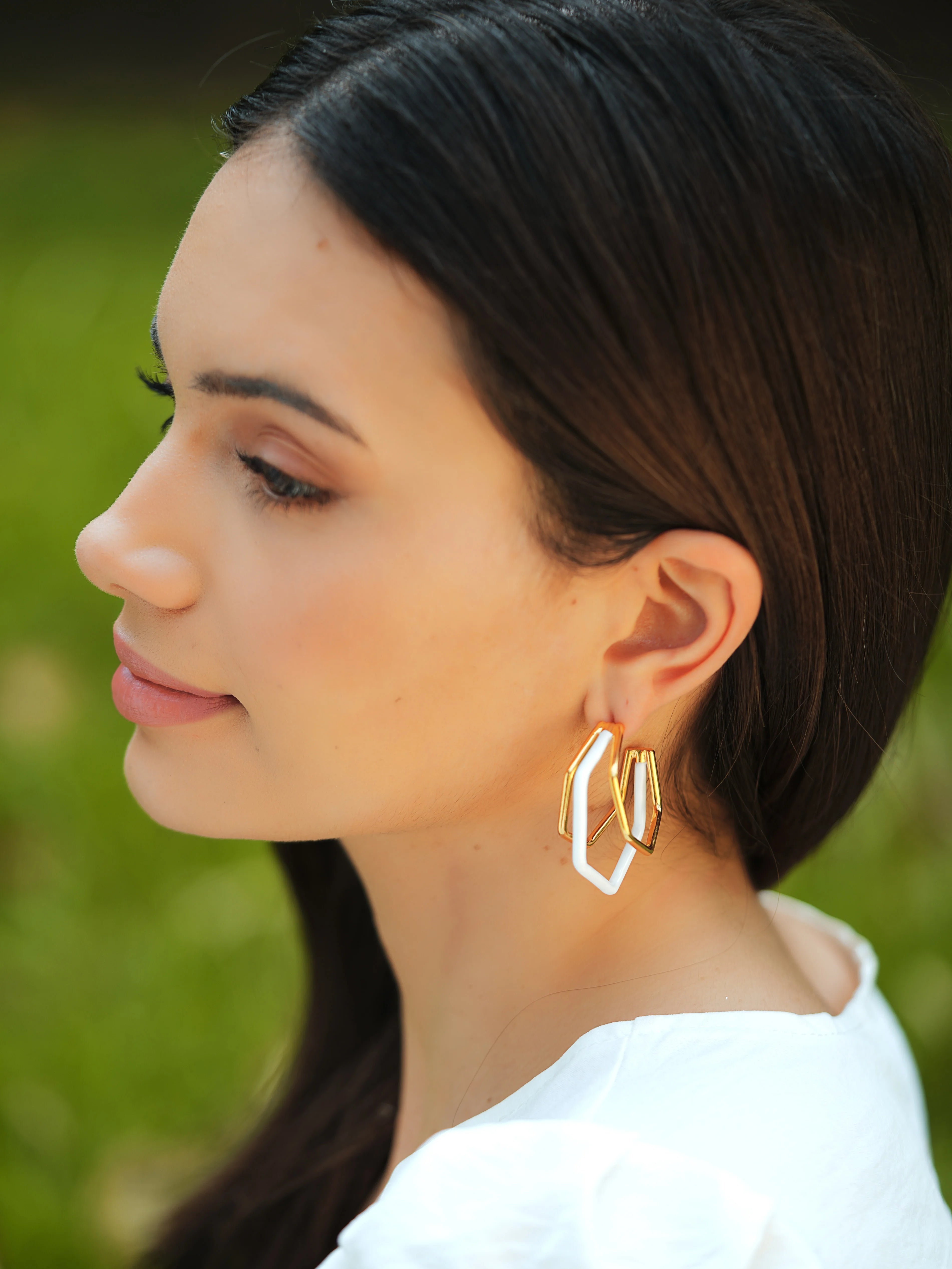 Small white enamel hoop earrings by Varnika Arora, featuring a stylish trio design with a smooth enamel finish.