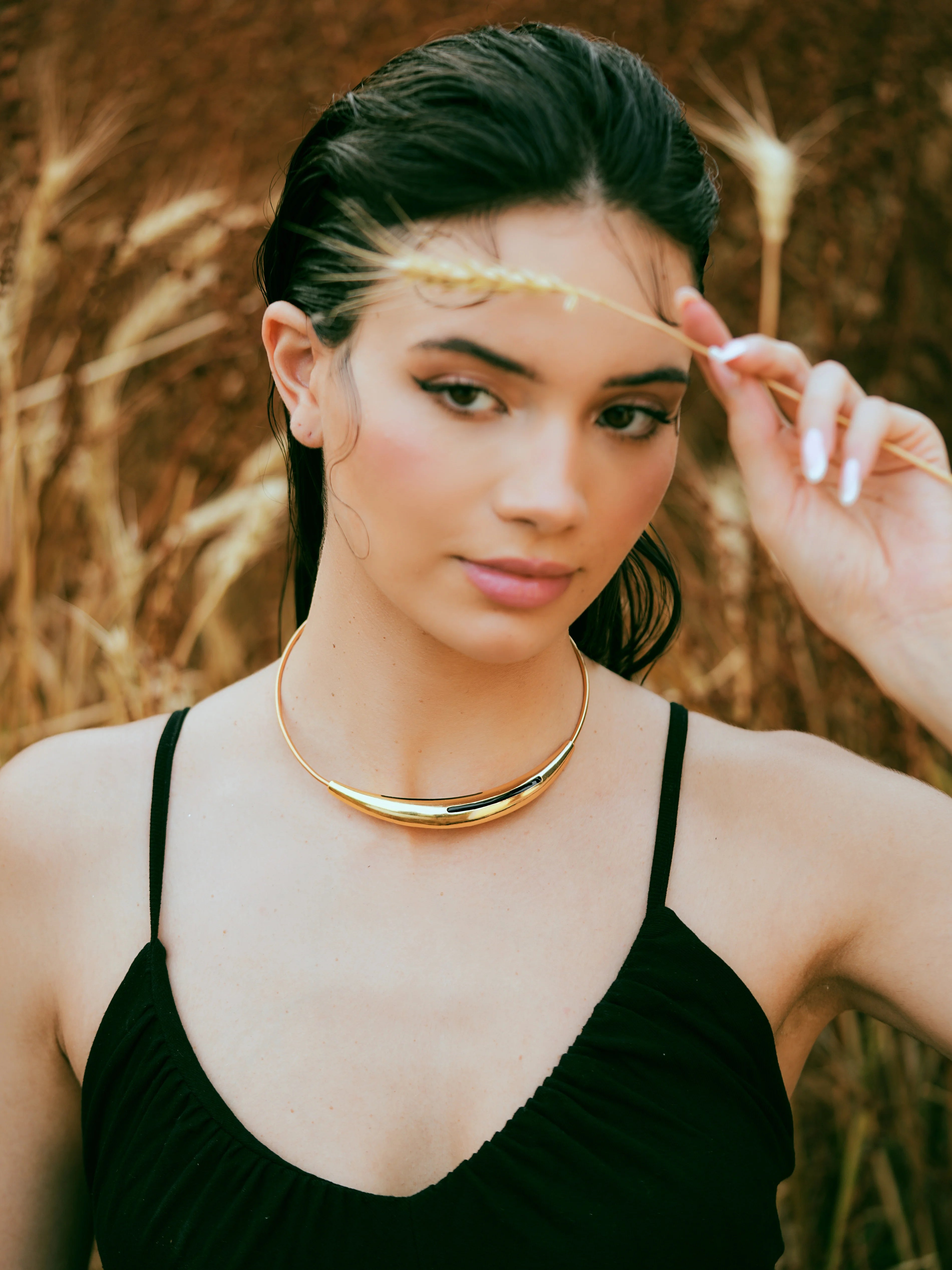 Varnika Arora Aurelia Black Enamel Gold Neckpiece featuring intricate black enamel design and elegant gold accents.