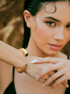 Varnika Arora Hexa Black Enamel Gold Bangle Cuff with geometric design and polished finish.