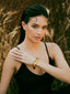 Varnika Arora black enamel gold bangle with elegant circular design, showcasing a sleek and polished jewelry piece.