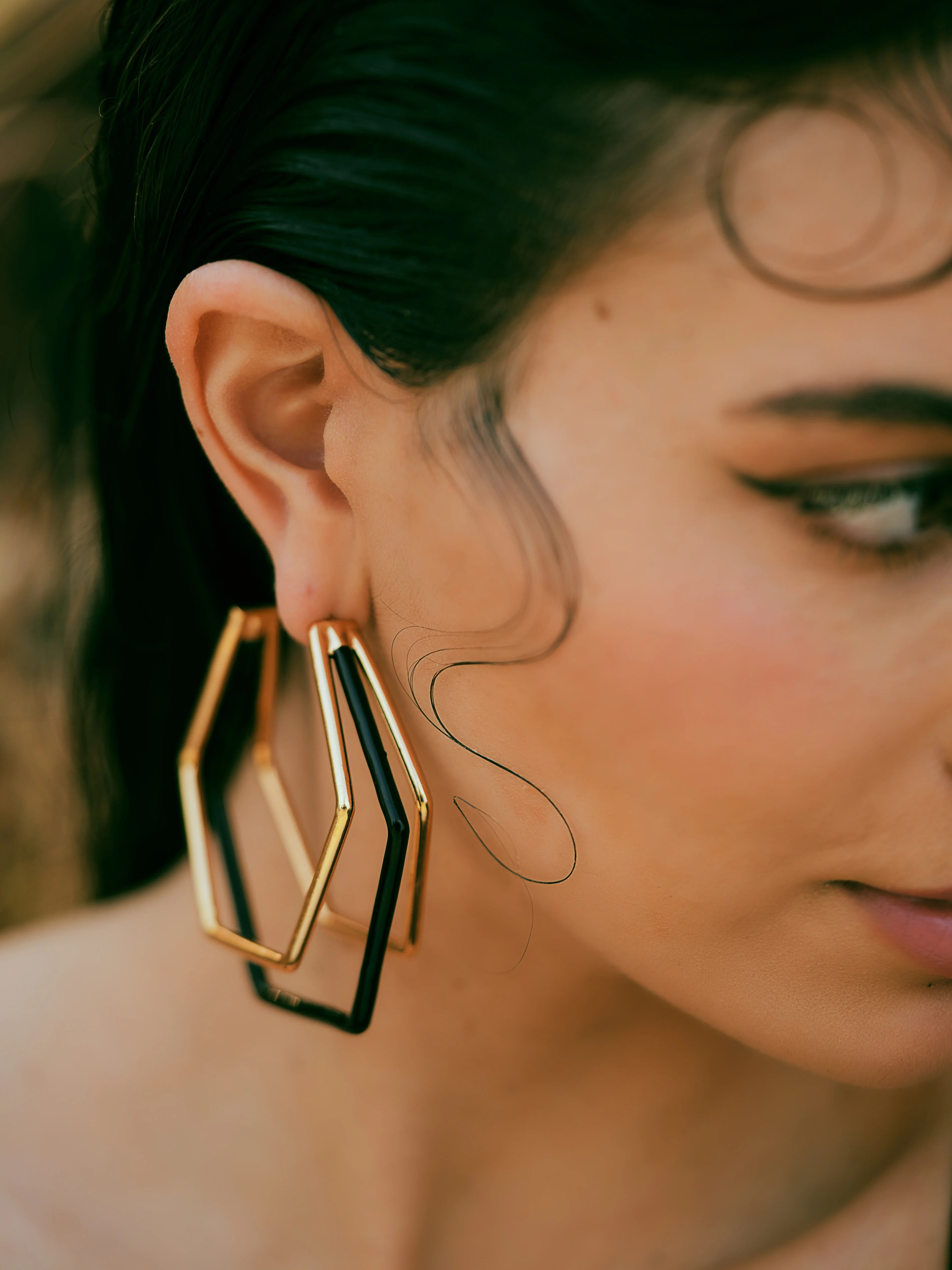 XL Trio black enamel gold hoops by Varnika Arora, showcasing three large stylish hoop earrings with black enamel and gold accents.