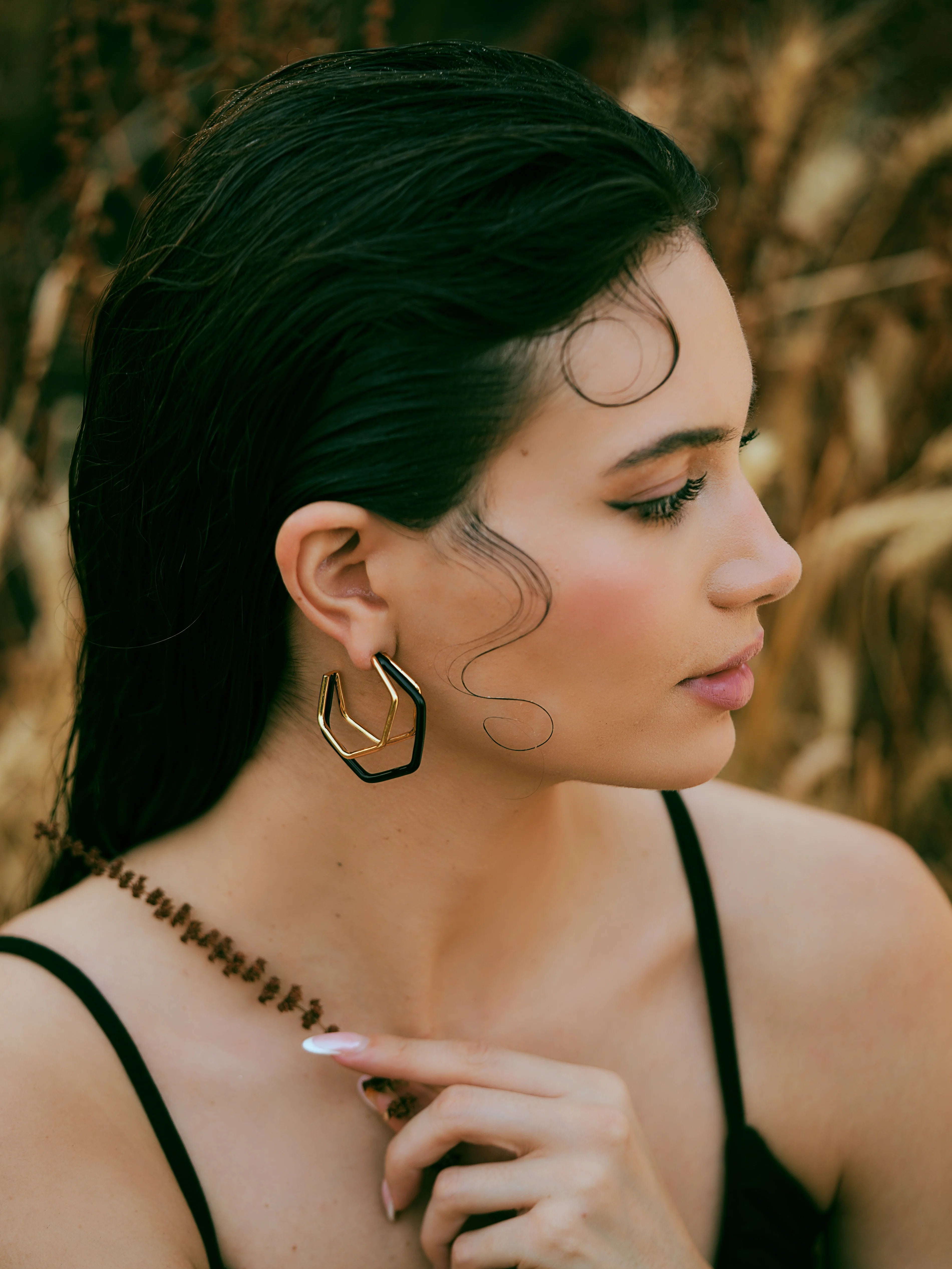 Small trio black enamel gold hoops by Varnika Arora, featuring three stylish hoop earrings with black enamel and gold finish.