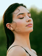 Varnika Arora Nova Gold Ear Cuffs, stylish and elegant jewelry accessory, featuring delicate gold design on a neutral background.