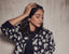 Regina Cassandra wearing Varnika Arora teeny earrings, close-up of her face and earrings at a photoshoot on September 5, 2022.