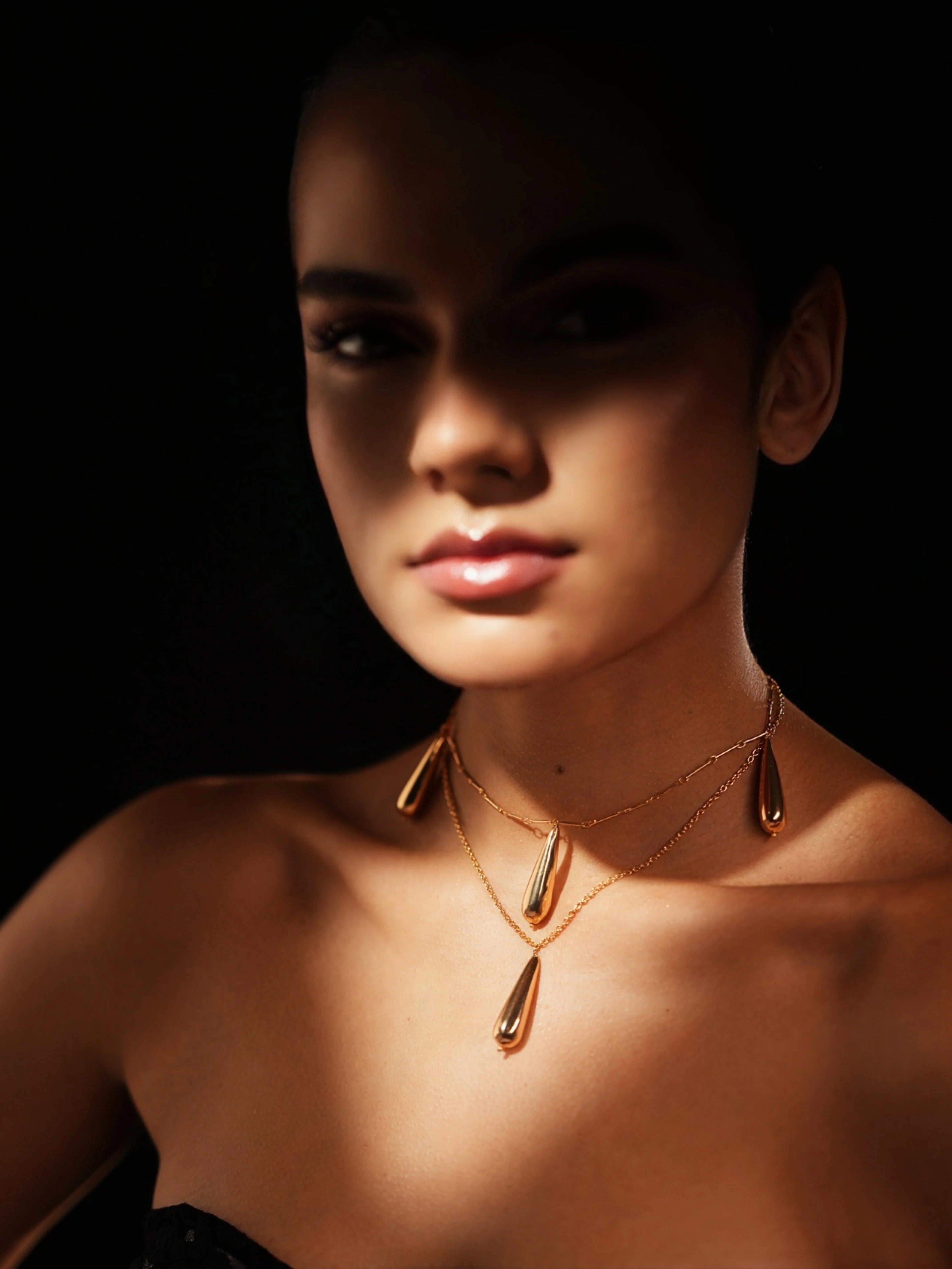 Dewdrop Necklace by Varnika Arora featuring a delicate, shimmering pendant with intricate detailing.
