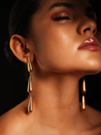 Varnika Arora Dewdrift Tier Drop jewelry earring featuring layered delicate gold tiers with intricate design details.