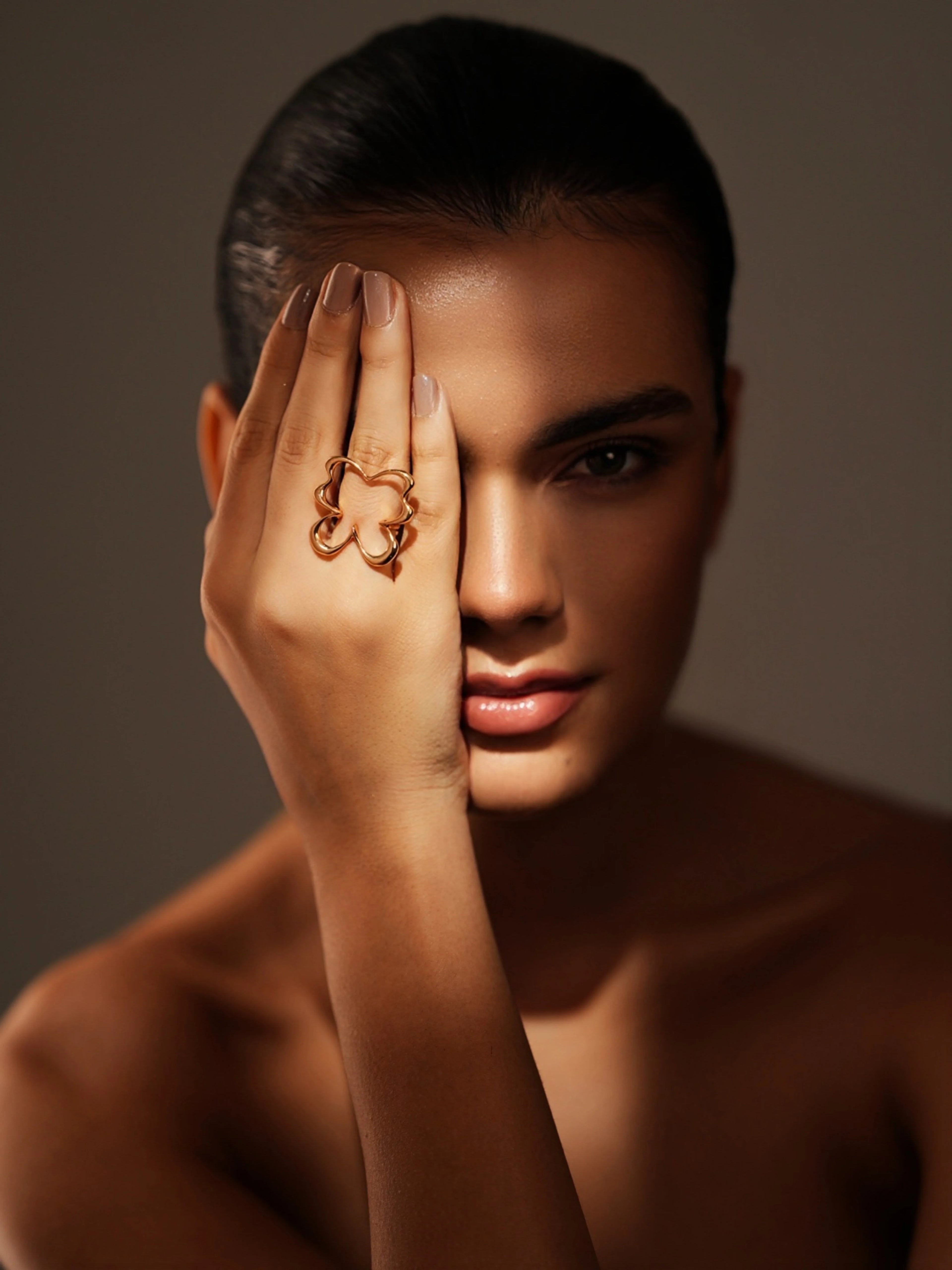 Varnika Arora The Morpho Ring featuring intricate silver design with a prominent blue gemstone center.