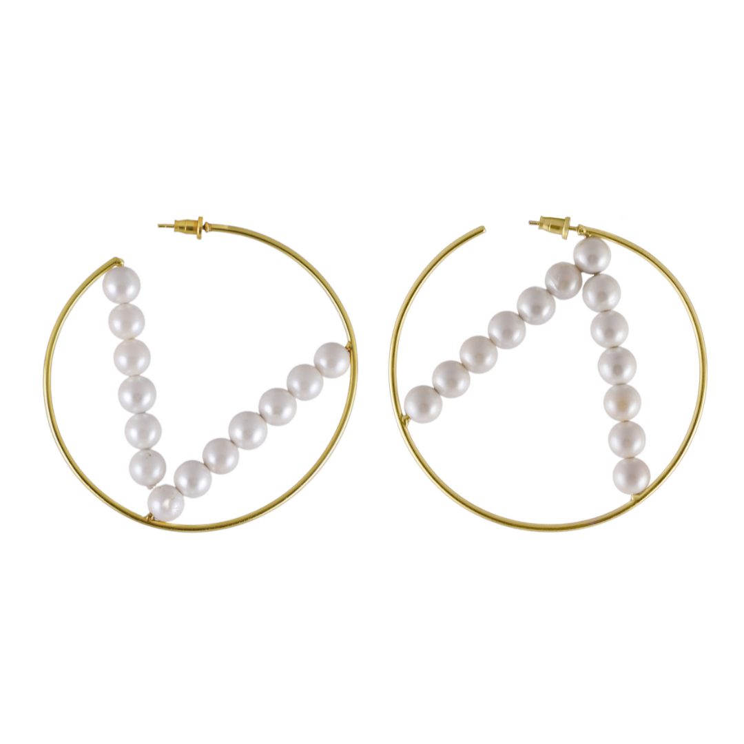 Rakulpreet wearing Varnika Arora Luna Hoop Earrings, stylish gold hoops with intricate design, close-up view. Main image