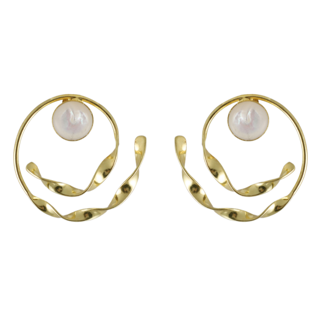 Mira Kapoor wearing Varnika Arora Ava earrings, stylish gold stud earrings with intricate design, close-up view of the jewelry. Main image