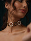 Varnika Arora Deco Drop IVANA jewelry featuring elegant gold drop earrings with intricate detailing and gemstone accents.